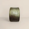 The golden curly ribbon decorates the gift box packaging ribbon details Picture